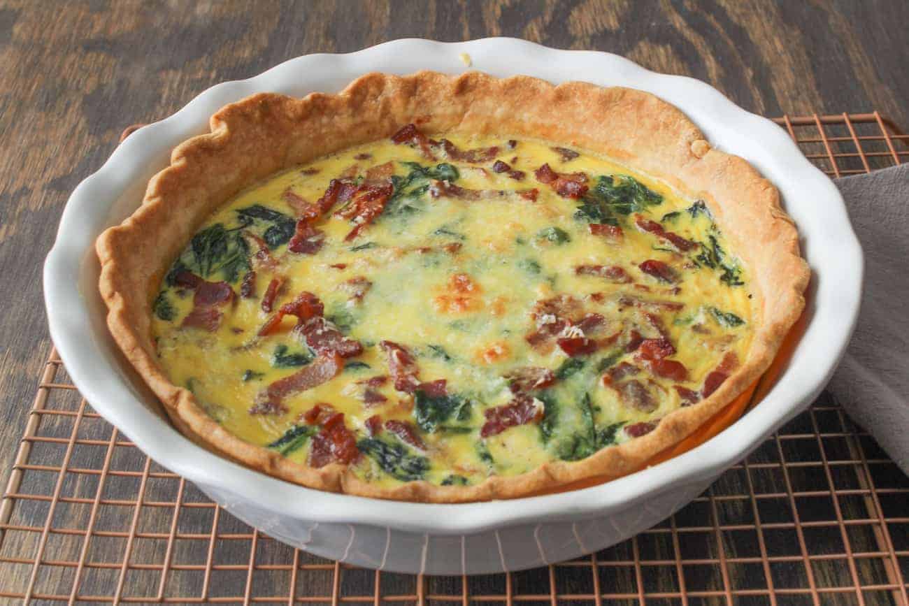 spinach bacon quiche on cooling rack