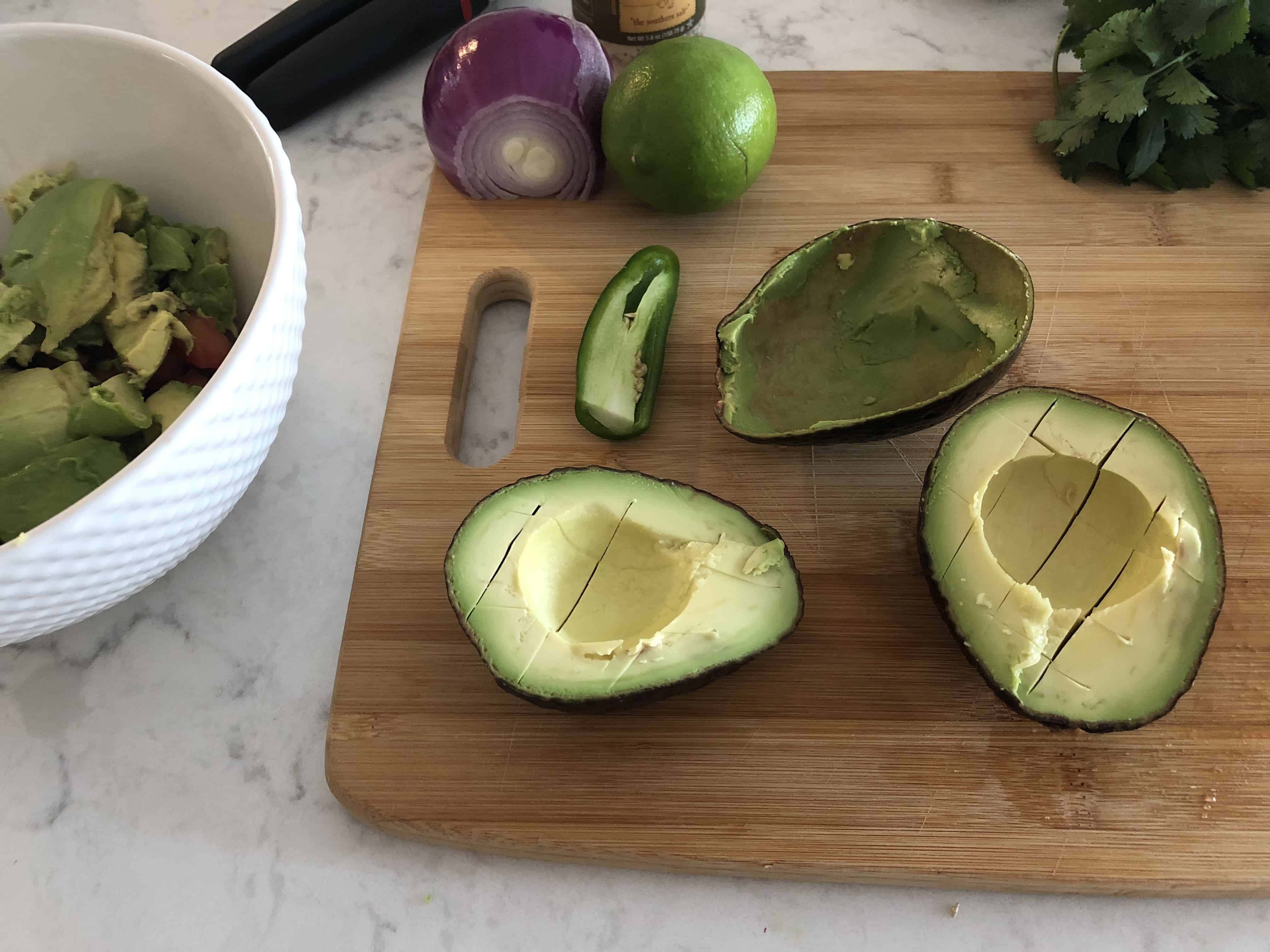 halved avocados on a chopping board