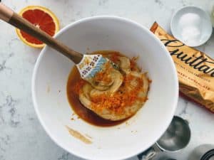 stirring wet ingredients in a bowl