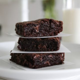 stack of fudge brownies on a plate