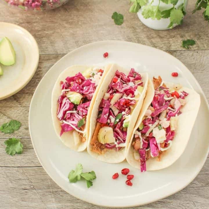 slow cooker chicken tacos with garnishes
