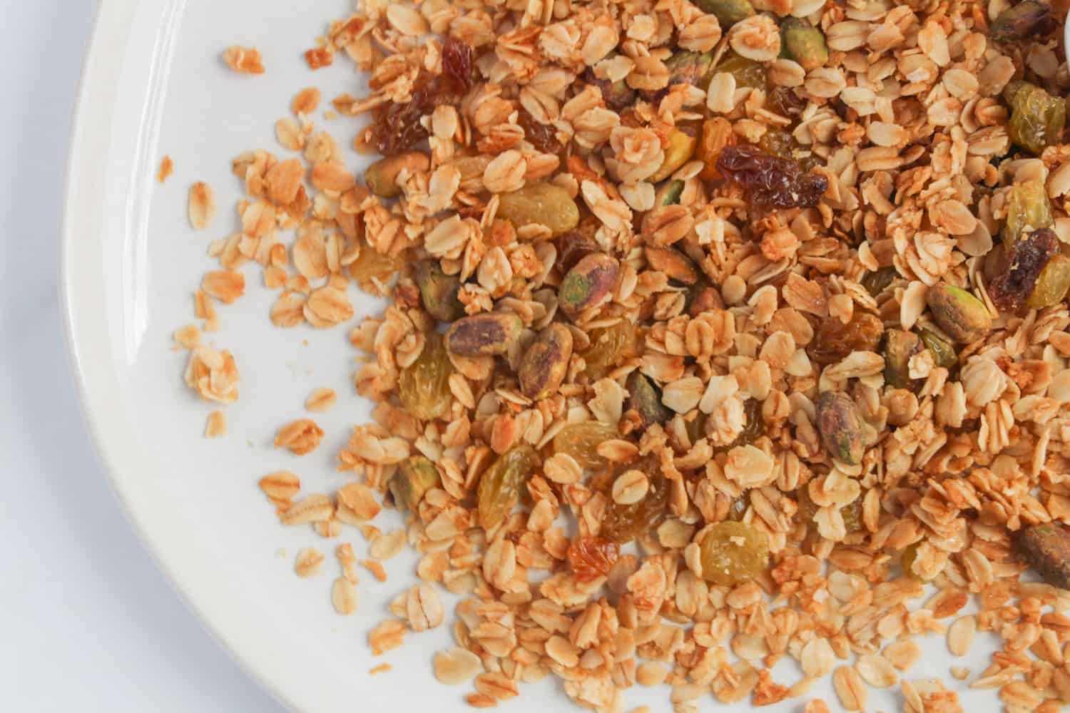 overhead shot of Maple and Thyme Granola on a white plate