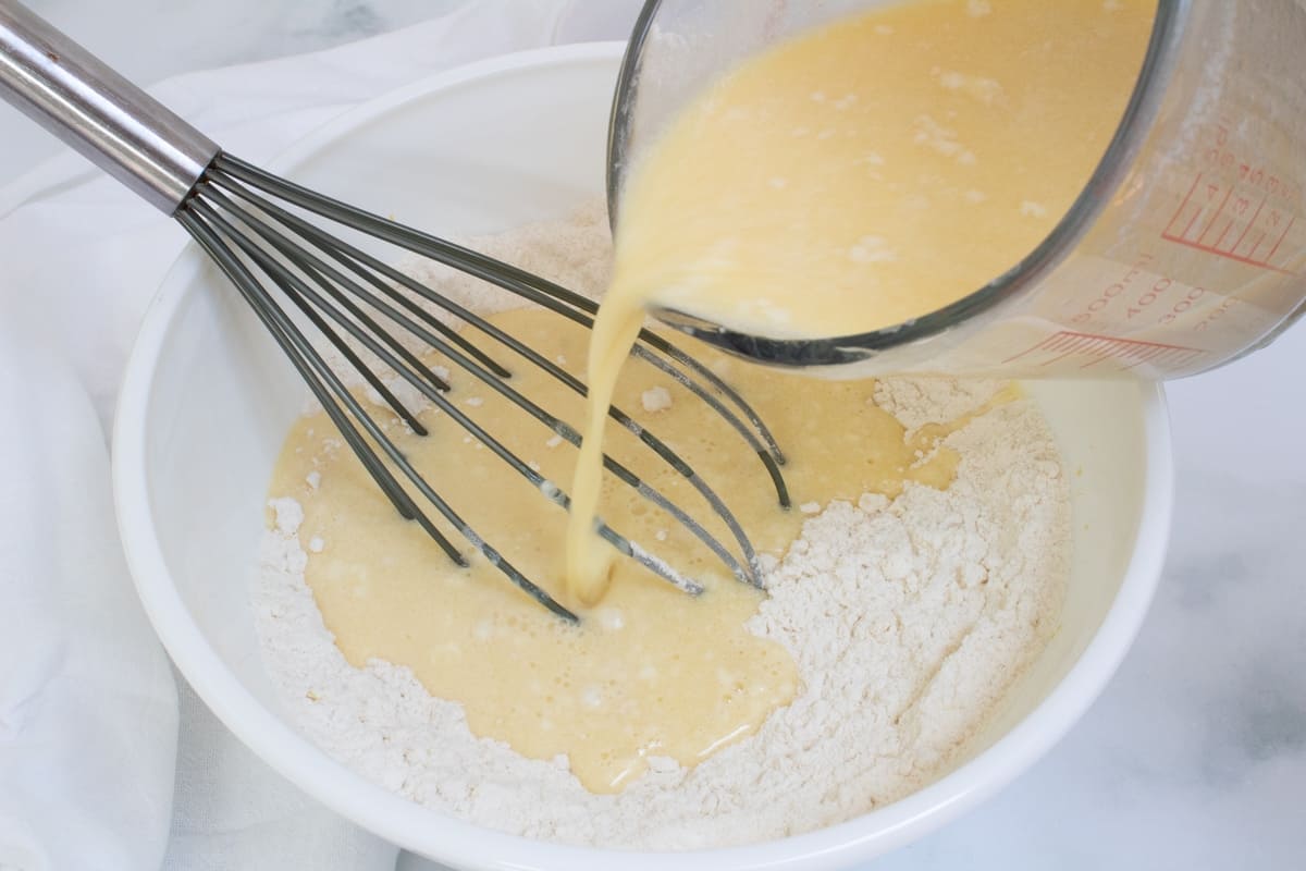 combining dry and liquid ingredients light and fluffy lemon pancakes