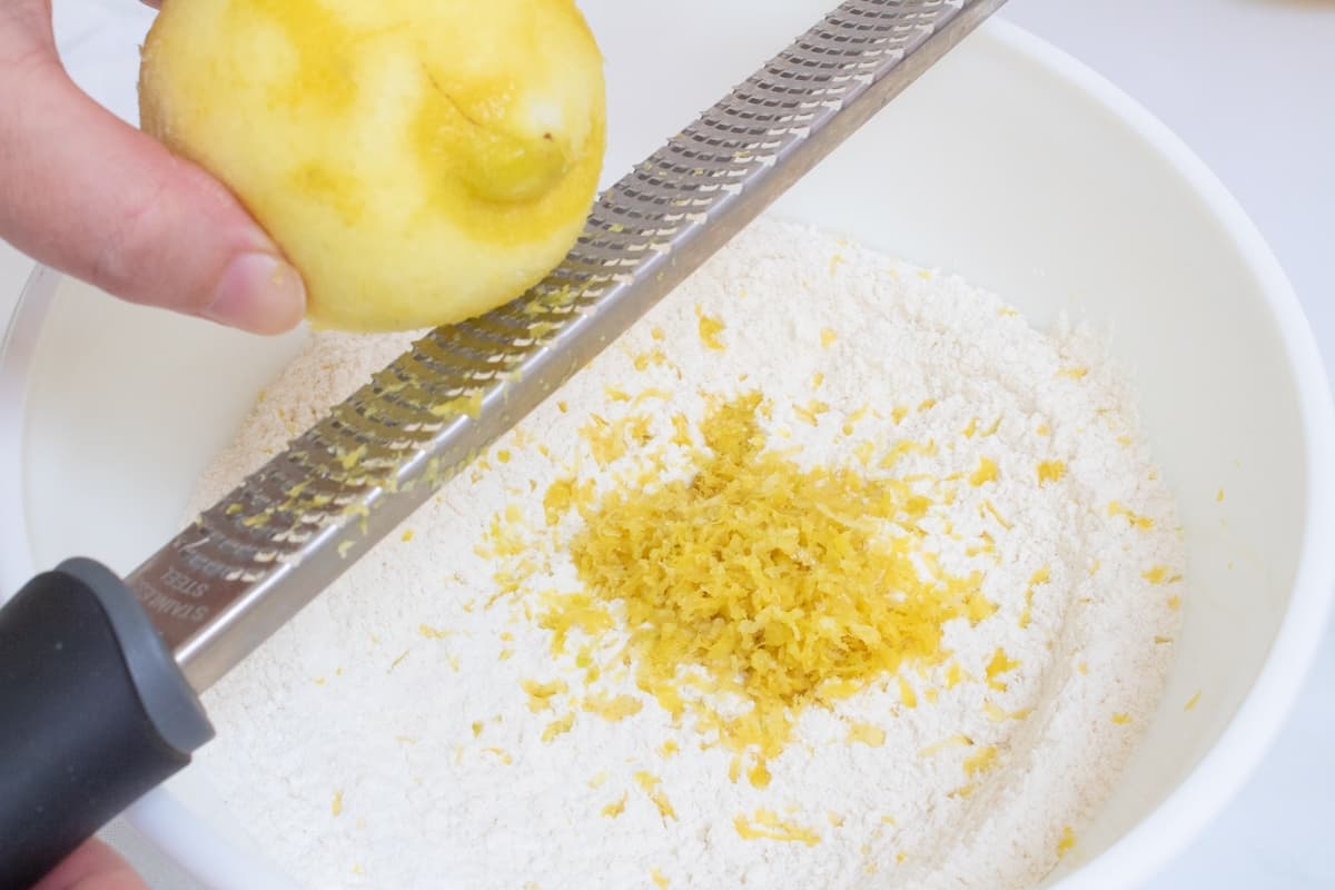 adding lemon zest to dry ingredients lemon pancakes