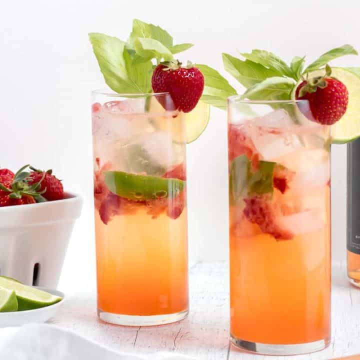 strawberry basil mojitos with bottle of rum