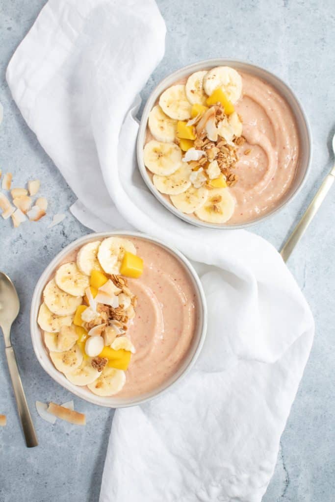 easy tropical smoothie bowls with granola and spoons