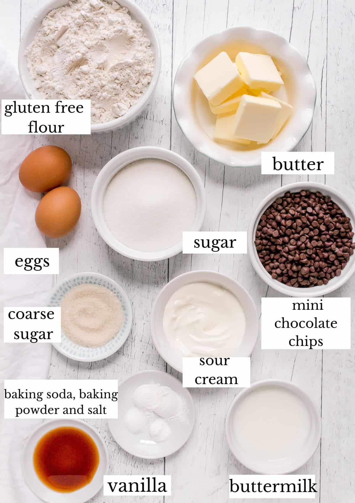 ingredients for gluten free chocolate chip muffins on white board