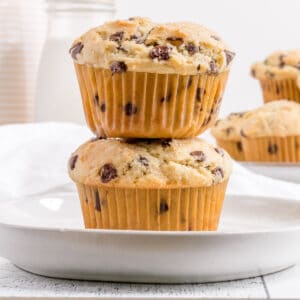 gluten free chocolate chip muffin stack on white plate