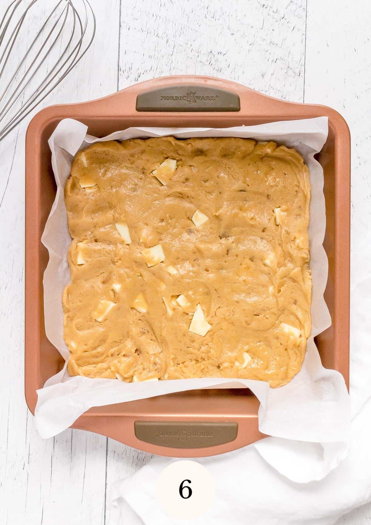 blondie batter in parchment lined baking pan