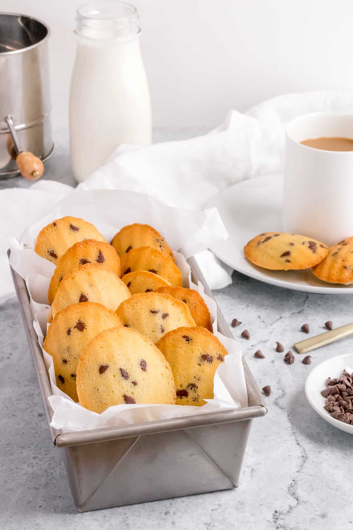 bread pan filled with chocolate chip madeleines