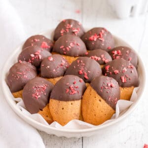 bowl of chocolate covered strawberry madeleines.