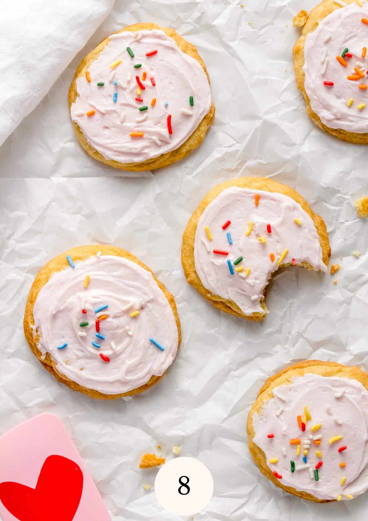 soft almond sugar cookies with frosting and sprinkles.