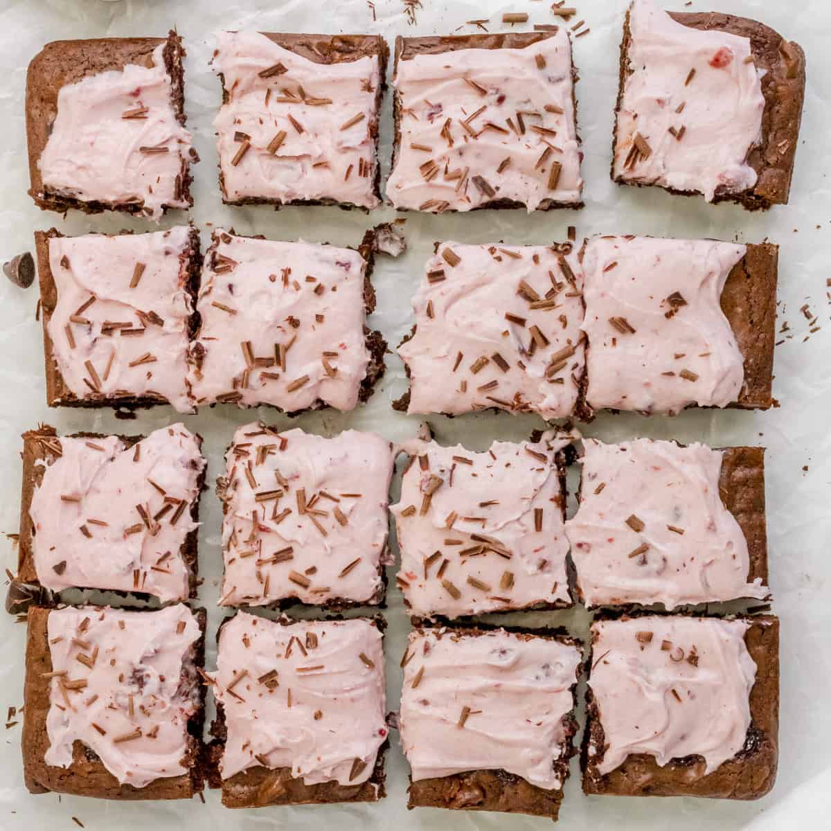 cherry chocolate brownies with cherry buttercream and shaved dark chocolate.