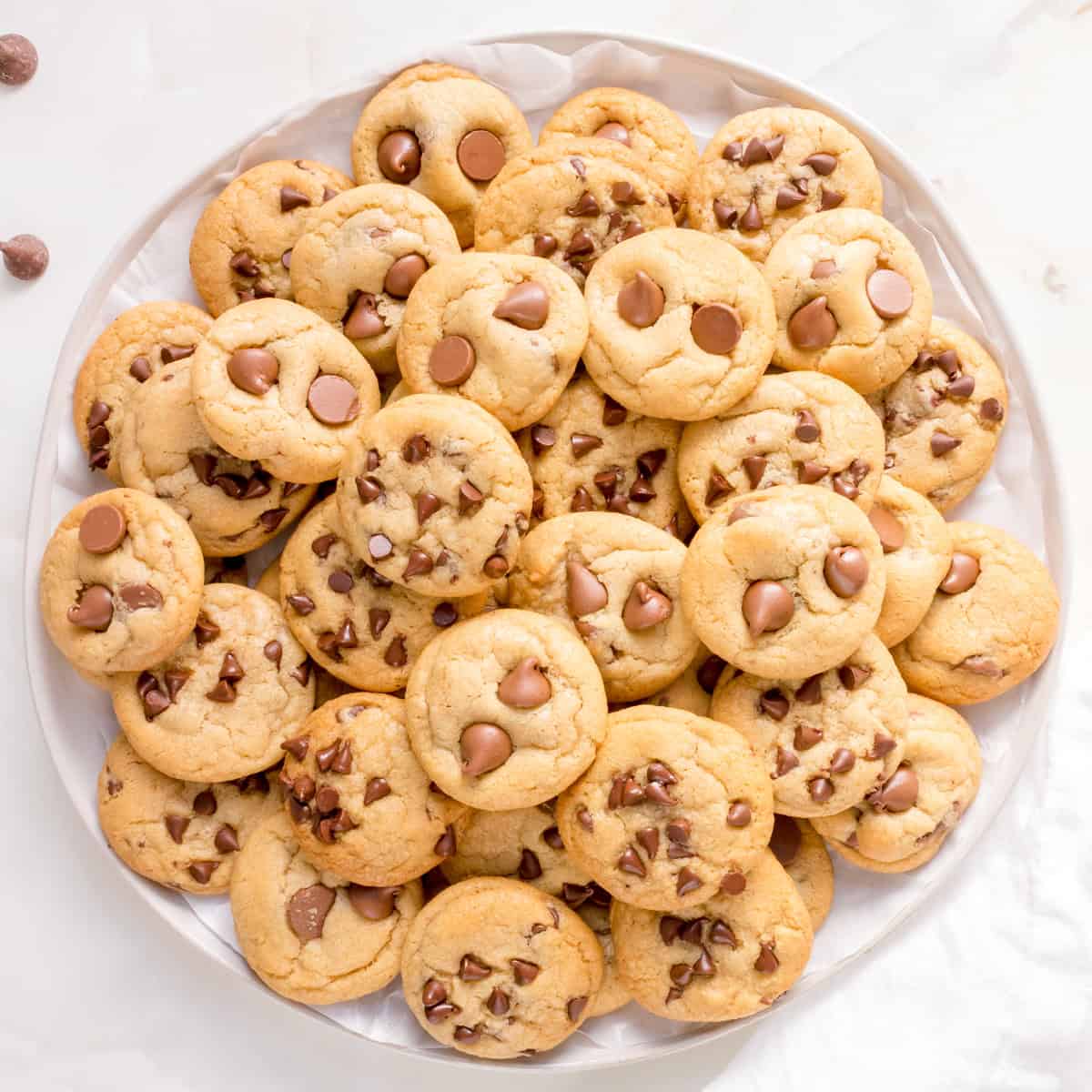 Round plate of mini chocolate chip cookies.