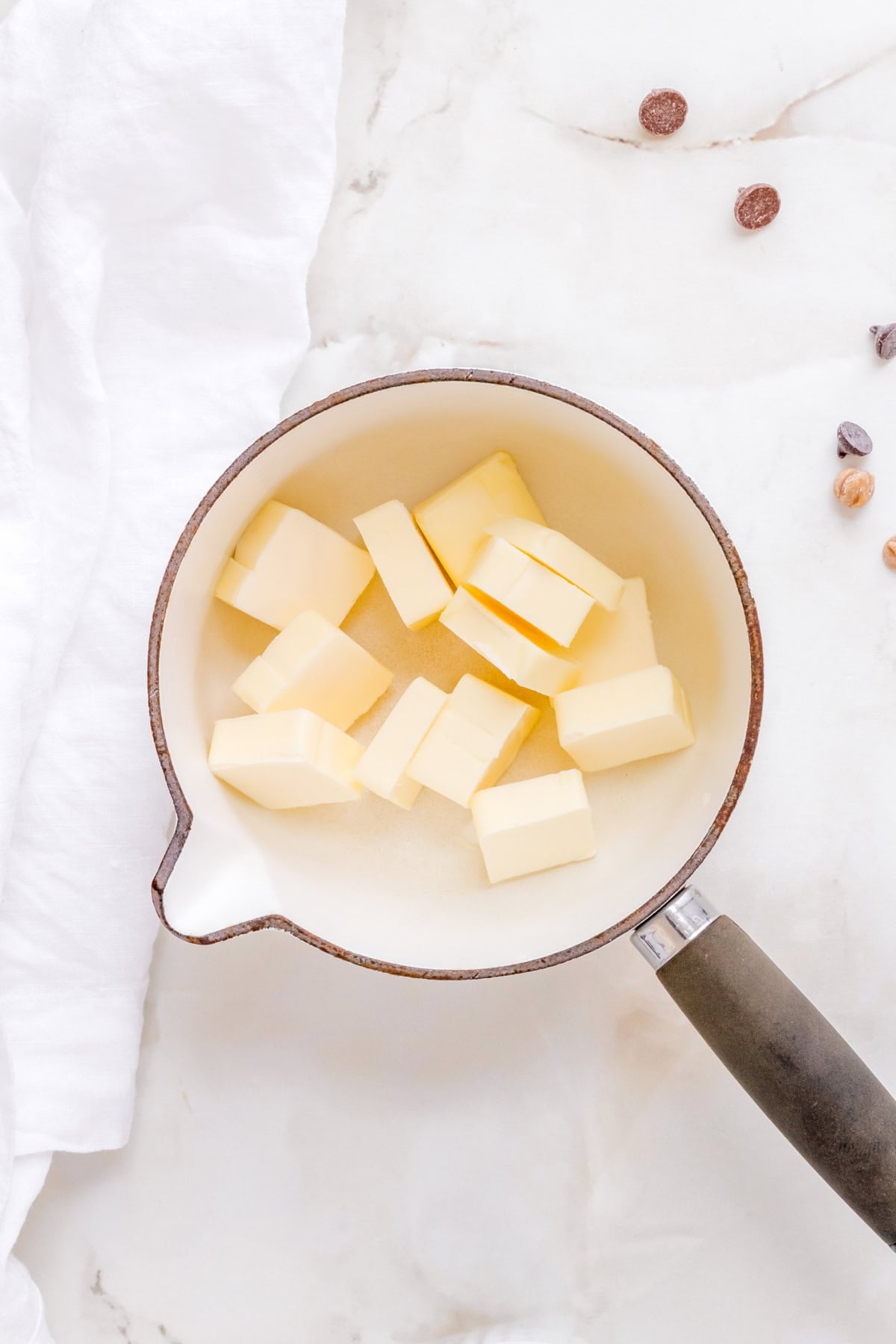 unsalted butter in a small white sauce pan.