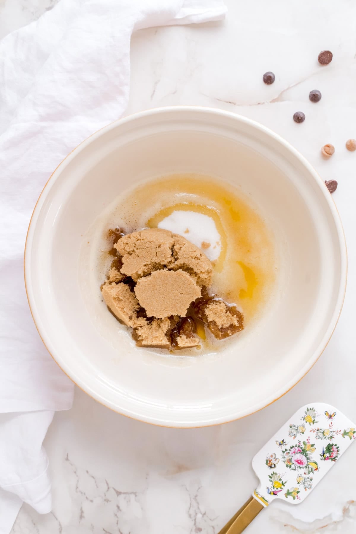 brown butter and sugar in white ceramic mixing bowl.