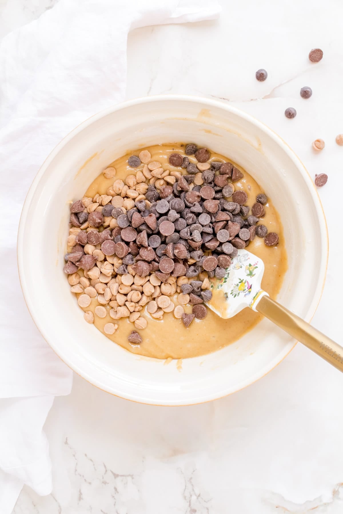chocolate chips and peanut butter chips in cookie dough.