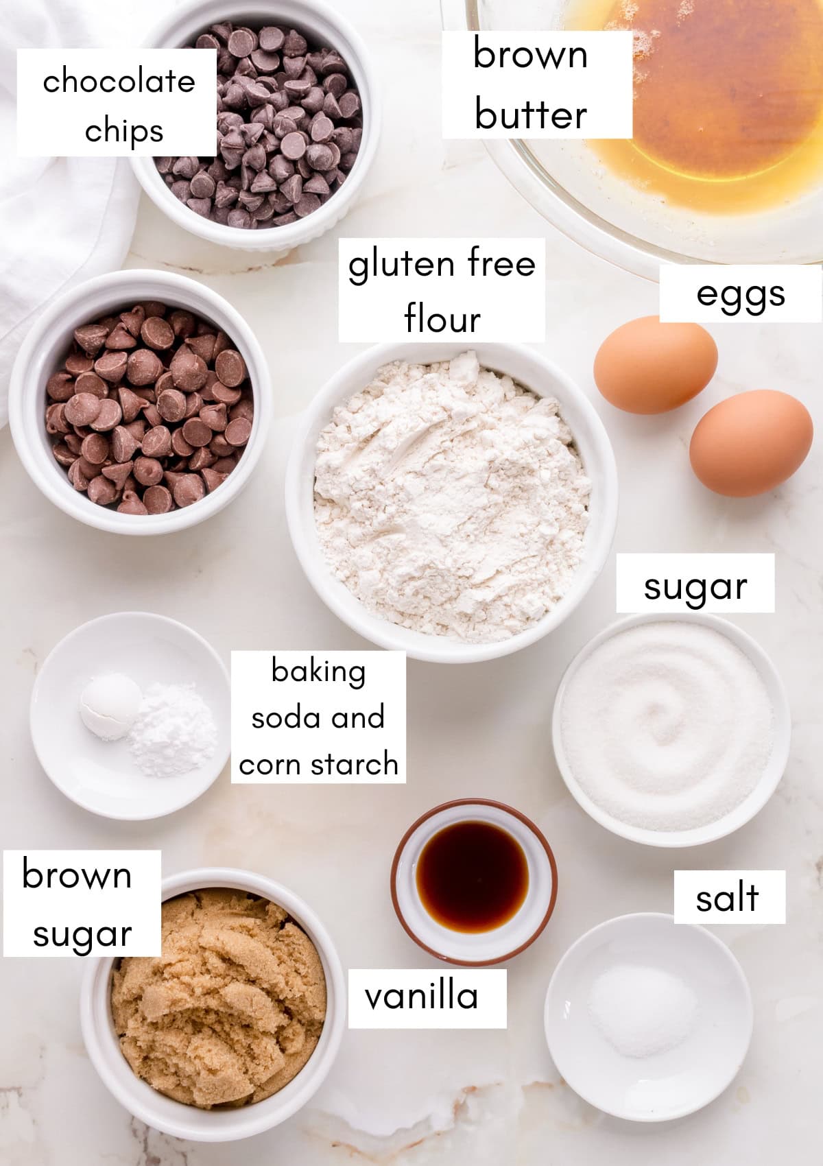 Labeled ingredients for gluten free pancake on white countertop.