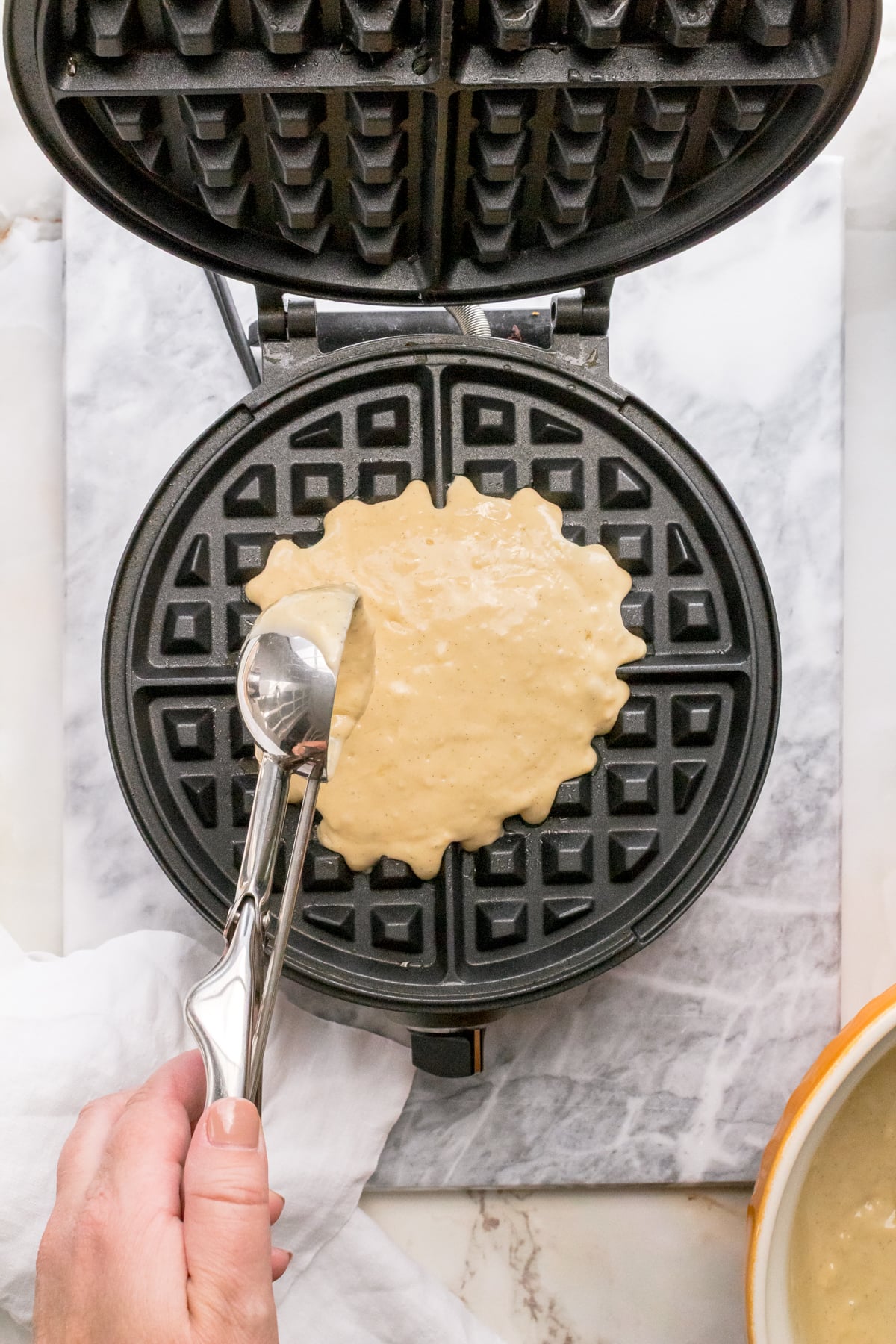 discard waffle batter cooking in waffle iron.