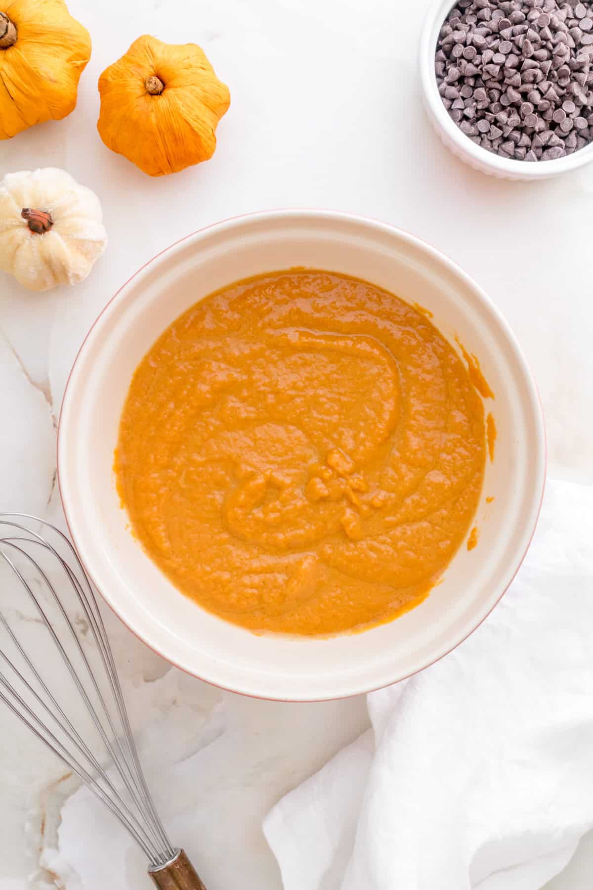 wet ingredients for pumpkin chocolate chip muffins in small mixing bowl.