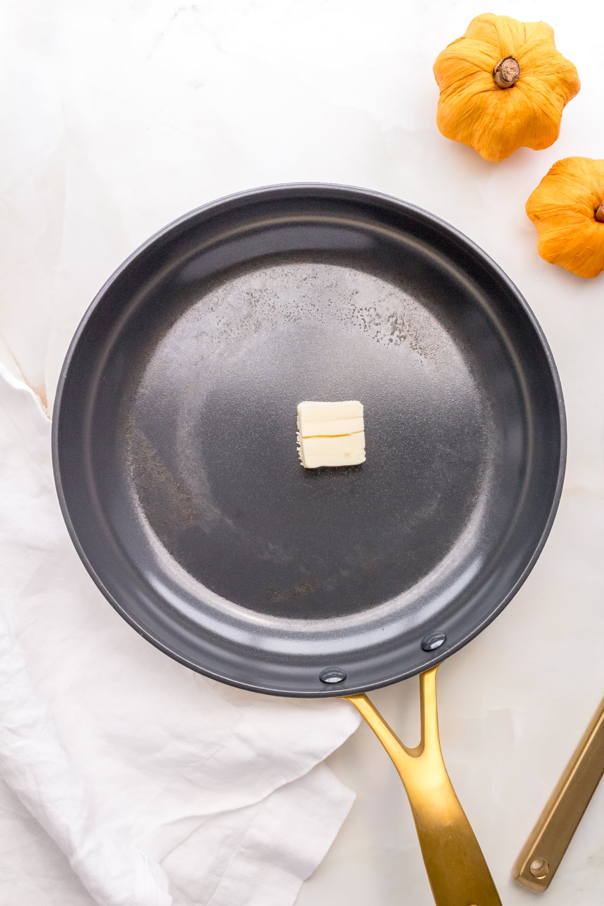 butter melting in nonstick frying pan.