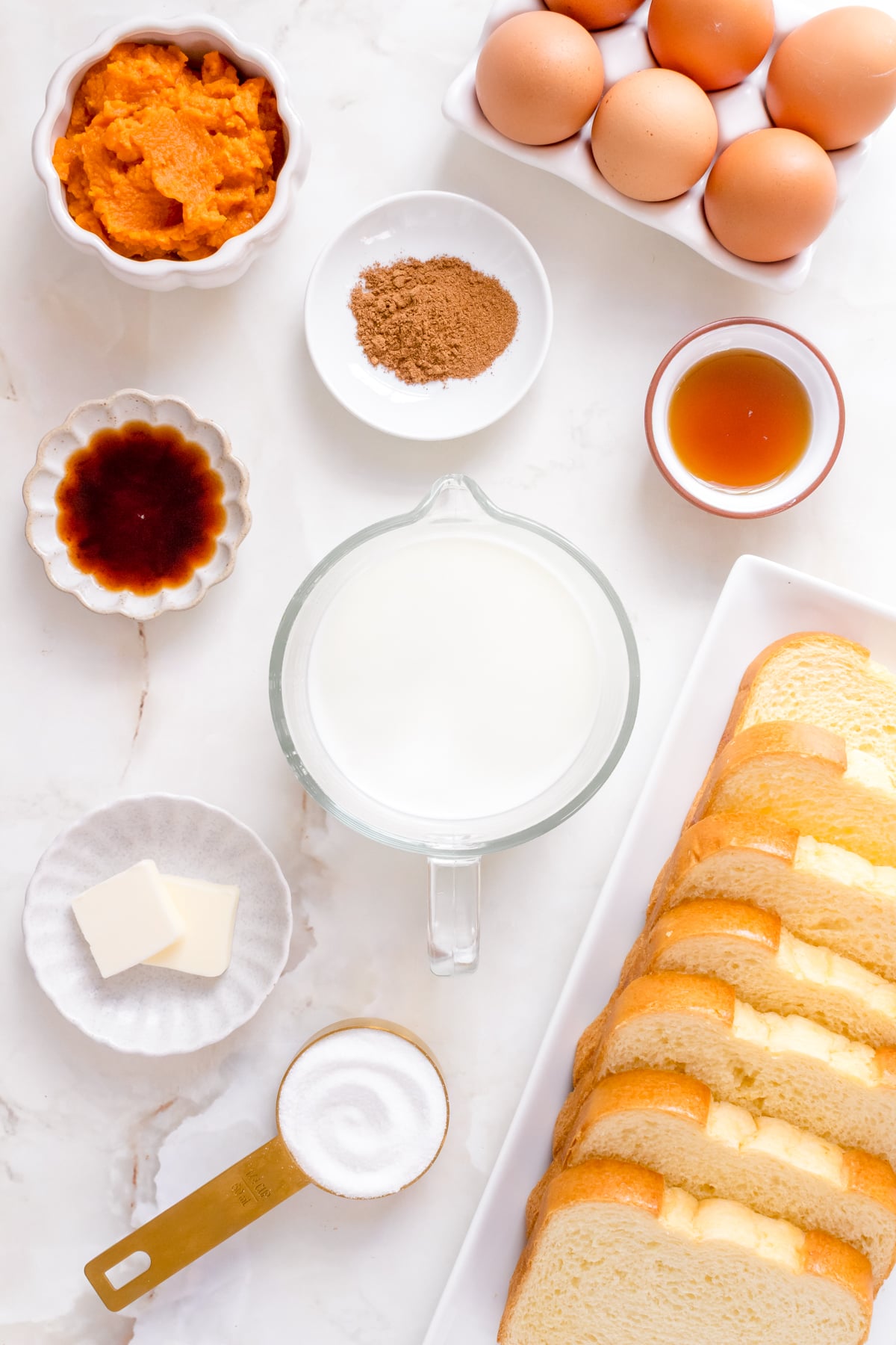 brioche for pumpkin French toast on white platter.